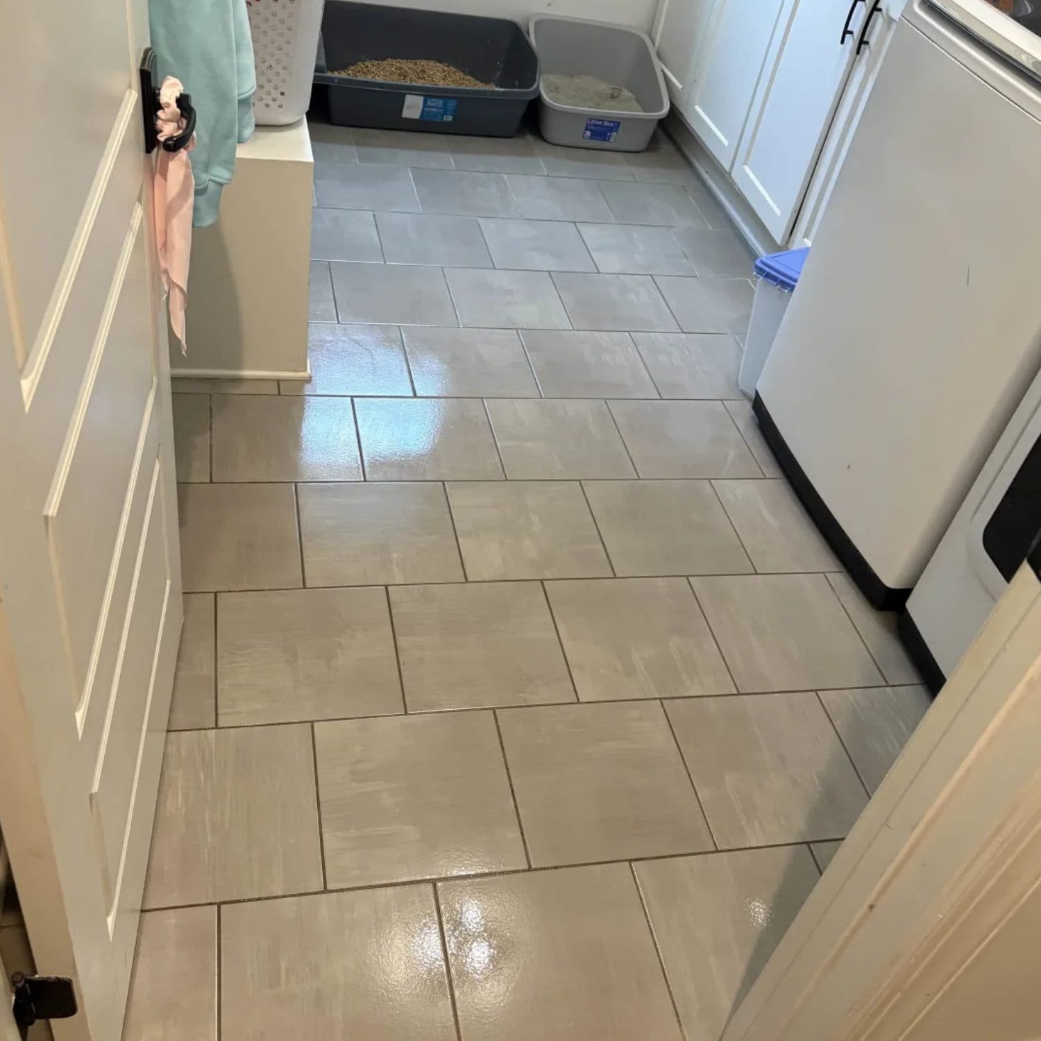 Freshly deep-cleaned gray tile floor with crisp, clean grout lines
